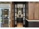 Butlers pantry features glass-front cabinets and a coffee bar at 211 N Esplanade, Alpharetta, GA 30009