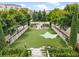 Lovely community dog park with artificial turf and ample shade at 211 N Esplanade, Alpharetta, GA 30009