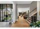 Bright entry with hardwood floors, a view of the backyard, and a modern staircase at 211 N Esplanade, Alpharetta, GA 30009