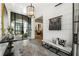 Elegant entryway featuring glass doors, a bench, and unique wall art at 211 N Esplanade, Alpharetta, GA 30009
