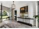 Bright and airy entryway with a statement rug and modern chandelier at 211 N Esplanade, Alpharetta, GA 30009