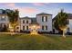 Stunning two-story home with a metal roof and charming landscaping at 211 N Esplanade, Alpharetta, GA 30009