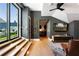 Comfortable game room with a large TV, leather chairs, and access to a balcony at 211 N Esplanade, Alpharetta, GA 30009