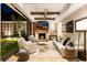 Relaxing Gathering room featuring a fireplace and sliding doors to backyard at 211 N Esplanade, Alpharetta, GA 30009