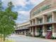 Whole Foods Market storefront with ample parking and outdoor seating at 211 N Esplanade, Alpharetta, GA 30009