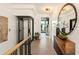 Elegant hallway with a modern elevator and a large mirror at 211 N Esplanade, Alpharetta, GA 30009