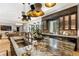 Open concept kitchen with large island, stainless steel appliances, and breakfast bar at 211 N Esplanade, Alpharetta, GA 30009