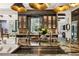 Luxury kitchen features a large island with prep sink and wine fridge at 211 N Esplanade, Alpharetta, GA 30009