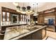 Open concept kitchen with a large island and stainless steel appliances at 211 N Esplanade, Alpharetta, GA 30009