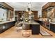 Gourmet kitchen boasts expansive island, high-end appliances, and custom cabinetry at 211 N Esplanade, Alpharetta, GA 30009