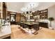 Elegant kitchen with center island, breakfast bar, and hardwood floors at 211 N Esplanade, Alpharetta, GA 30009
