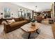 Living area with a large sofa and a unique coffee table at 211 N Esplanade, Alpharetta, GA 30009