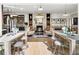 Open concept living area with a view of the kitchen and fireplace at 211 N Esplanade, Alpharetta, GA 30009