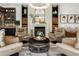 Living room with a fireplace and comfortable seating area at 211 N Esplanade, Alpharetta, GA 30009
