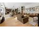 Open living space with hardwood floors and a view of the kitchen at 211 N Esplanade, Alpharetta, GA 30009