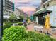 Restaurant patio with tables and umbrellas in a vibrant setting at 211 N Esplanade, Alpharetta, GA 30009