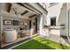 Outdoor kitchen and seating area with easy access to the backyard at 211 N Esplanade, Alpharetta, GA 30009