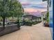 Outdoor patio with pergola and comfortable seating under sunset sky at 211 N Esplanade, Alpharetta, GA 30009