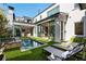Private backyard oasis with a luxurious pool and lounge area at 211 N Esplanade, Alpharetta, GA 30009