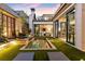 Night view of a luxurious pool and outdoor living space at 211 N Esplanade, Alpharetta, GA 30009