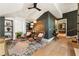 Relaxing sitting room with leather armchairs and built-in shelves at 211 N Esplanade, Alpharetta, GA 30009