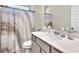 Bathroom with shower/tub combo and updated vanity at 9026 Jim Purcell Dr, Covington, GA 30014