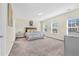 Spacious bedroom with large windows and plush carpeting at 9026 Jim Purcell Dr, Covington, GA 30014
