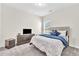 Cozy bedroom with a comfortable bed and ample storage at 9026 Jim Purcell Dr, Covington, GA 30014