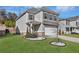 Charming two-story home featuring a manicured lawn and inviting curb appeal at 9026 Jim Purcell Dr, Covington, GA 30014