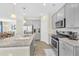 Modern kitchen with gray cabinets, granite countertops, and stainless steel appliances at 9026 Jim Purcell Dr, Covington, GA 30014