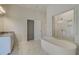 Elegant bathroom with soaking tub, walk-in shower, and separate vanity at 2731 Dolce Rd, Dacula, GA 30019