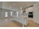 Modern kitchen with white cabinets, quartz countertops, and stainless steel appliances at 2731 Dolce Rd, Dacula, GA 30019