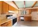 Bright kitchen with wood cabinets and stove at 4418 Palm Springs Dr, Atlanta, GA 30344