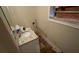 Small bathroom with vanity and damaged wall needing repair at 1272 Marlwood Ct, Stone Mountain, GA 30083