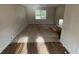 Empty living room with hardwood and carpeted floors at 1272 Marlwood Ct, Stone Mountain, GA 30083