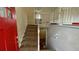 View of the staircase leading to the upper level, red front door visible at 1272 Marlwood Ct, Stone Mountain, GA 30083