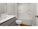 Bathroom featuring a tub-shower combination, gray vanity with double sinks, and hard surface floors at 4150 Cavalier Way, Duluth, GA 30097