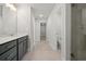New bathroom boasts double vanity, tiled floors and walk-in shower with glass door at 4150 Cavalier Way, Duluth, GA 30097