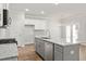 Kitchen boasts a large island with granite countertops, stainless steel appliances, and ample storage at 4150 Cavalier Way, Duluth, GA 30097