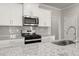 Modern kitchen featuring granite countertops, stainless steel appliances, and ample cabinet space at 4150 Cavalier Way, Duluth, GA 30097