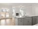 Bright kitchen featuring granite countertops, stainless steel appliances, and an open view to the living area at 4150 Cavalier Way, Duluth, GA 30097