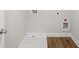 A well-lit laundry room featuring vinyl floors and washer and dryer hook-ups at 4150 Cavalier Way, Duluth, GA 30097