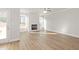 Spacious living room with wood floors, fireplace and windows providing natural light at 4150 Cavalier Way, Duluth, GA 30097