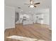 Open-concept living area with a modern kitchen featuring an island and stainless appliances at 4150 Cavalier Way, Duluth, GA 30097
