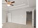 A main bedroom featuring a tray ceiling and doorway at 4150 Cavalier Way, Duluth, GA 30097