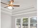 A main bedroom featuring a tray ceiling and large windows at 4150 Cavalier Way, Duluth, GA 30097