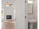 View through open doorway of powder room with pedestal sink and fixtures at 4150 Cavalier Way, Duluth, GA 30097