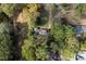 Aerial view of property nestled among mature trees offering shade and privacy at 1141 Goodwin Ne Pl, Brookhaven, GA 30319