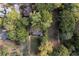 Aerial view of property nestled among mature trees offering shade and privacy at 1141 Goodwin Ne Pl, Brookhaven, GA 30319