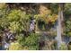 Aerial view of a house surrounded by lush trees near the street at 1141 Goodwin Ne Pl, Brookhaven, GA 30319